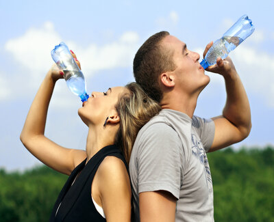 Man and woman drinking water